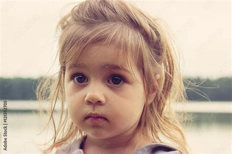 Toned Closeup Portrait Of Beautiful Girl With Big Sad Eyes Stock Foto