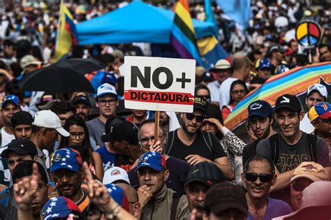 2 dead as Venezuela protests turn violent outside capital