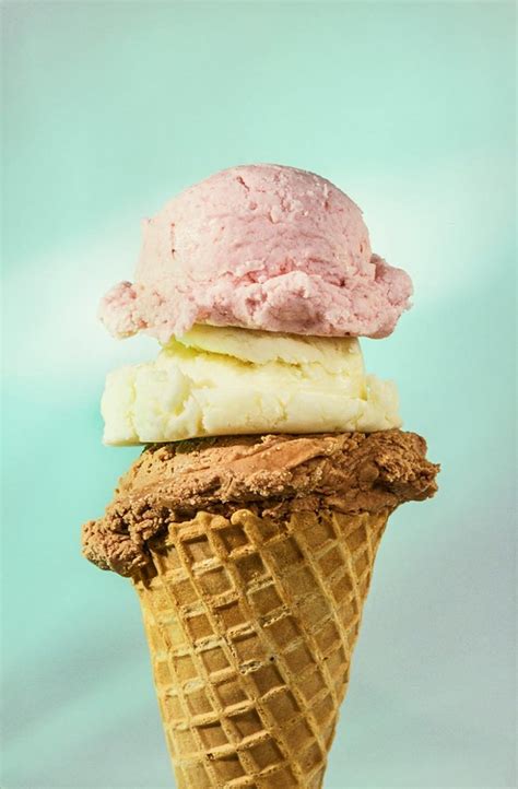 Triple Scoop Ice Cream Cone Of Chocolate Vanilla And Strawberry