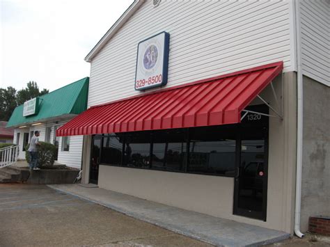 Lawrence fabric & metal structures custom commercial fabric/metal awnings and canopies. Metal Awnings