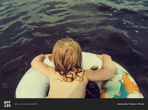 Caucasian Girl Swimming In Lake Stock Photo Offset