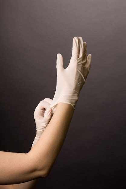 Premium Photo Woman Putting On Latex Protective Gloves