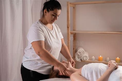 Face Massage Caucasian Woman Getting Spa Treatment Side View Masseur Doing Rejuvenating