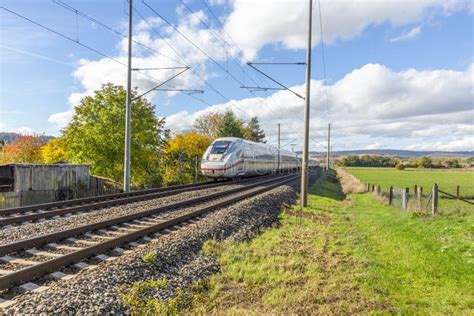High Speed Train Passes A Railroad Crossing At Herleshausen Germany