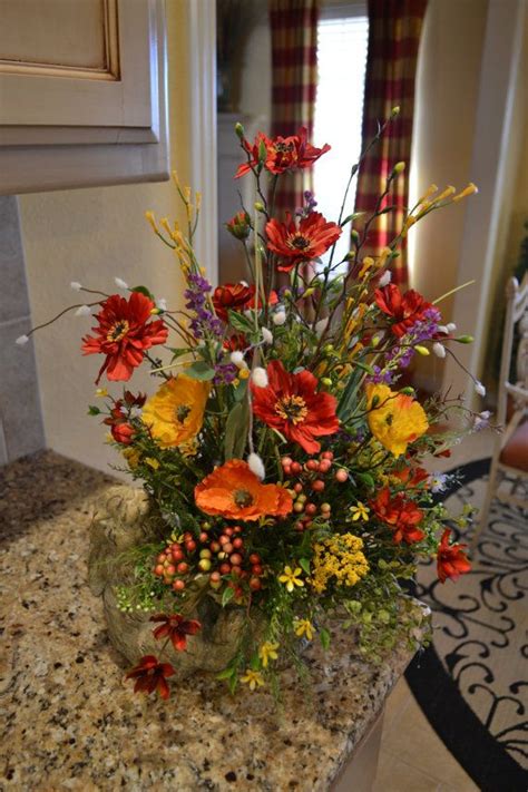 Exclusively ours.this bounteous arrangement of hydrangeas, peonies, ranunculus, proteas and dusty miller are presented in a striated glass round. Spring Bunny Arrangement | Large flower arrangements, Faux ...