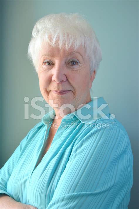 Attractive Senior Woman Smiling Looking Bemused Stock Photo Royalty