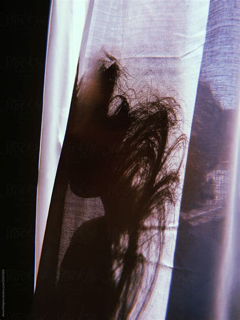 A Woman Hiding Behind A Curtain By Stocksy Contributor Anna Malgina Stocksy