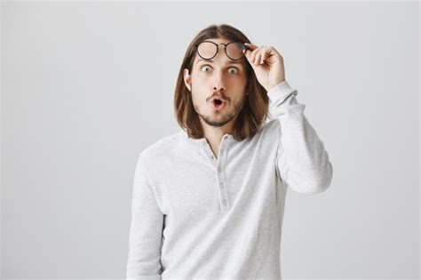 Free Photo Impressed Handsome Guy Take Off Glasses And Looking Astonished