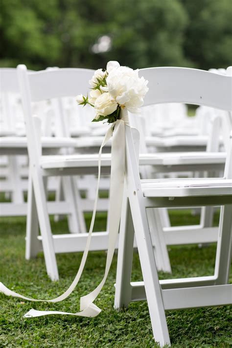 Outdoor event chairs are sometimes confused with director's chairs. Ceremony Décor Photos - White Chairs with White Flowers ...