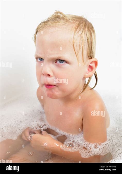 Little Girl Taking A Bath Making A Face Stock Photo Alamy