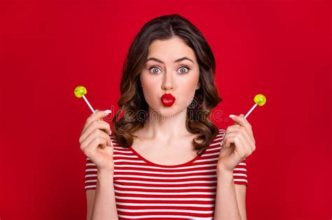Photo Of Funny Lady Send Kiss Hold Two Yellow Lollipop Candy Sugary