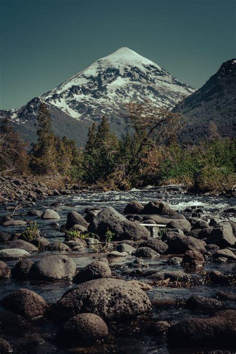 Rocky Stream And The Lanin Volcano In Lanin National Park Patagonia