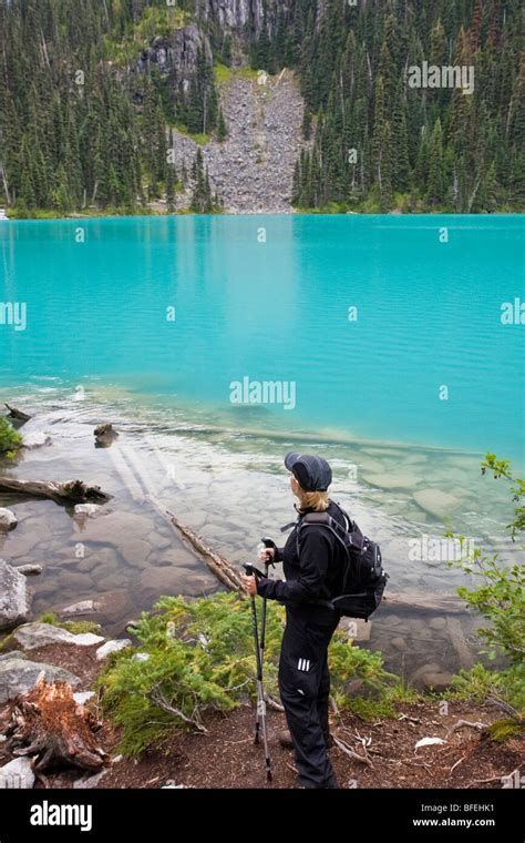 Woman Hiking At Joffre Lakes Provincial Park Located Between Towns Of