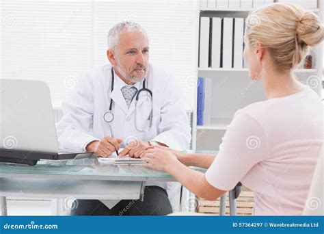 Patient Consulting A Serious Doctor Stock Image Image Of Mature