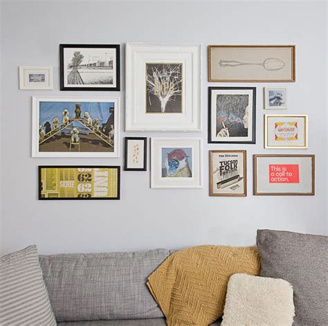 Build a photo wall with a bunch of family pictures, or opt for frames sans photos to create a wall frame collage—it's up to you. How to Create a Perfect Gallery Wall | mox & fodder