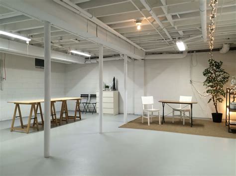Art studio in semi finished basement, spray paint ceiling white