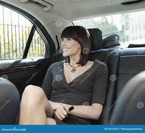 Businesswoman Sitting At Back Seat Of Car Stock Image Image Of Female Attractive 33915303