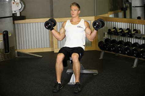 Seated Dumbbell Inner Biceps Curl Exercise Guide And Video