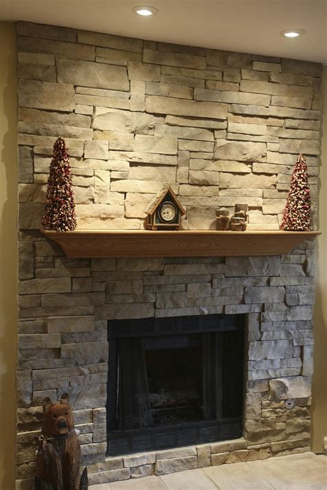 If you have an uninspired brick fireplace or an interior brick interior wall that looks dated, you might be looking for ways to improve its appearance. Fake Stone Fireplace Mantel | Stone veneer fireplace ...