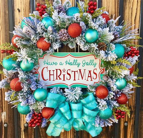 A Christmas Wreath Hanging On The Side Of A Wooden Fence With Blue And