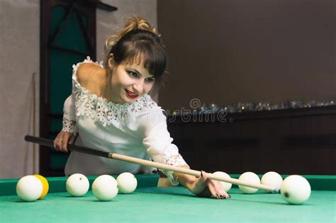 A Brunette Woman Plays Billiards In A Nightclub Stock Image Image Of Green Club 173483481