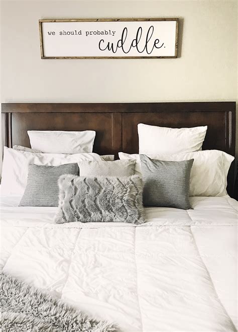 Build an eclectic arrangement above your bed. Grey and whites in bedroom. Loving this Above bed wall art ...