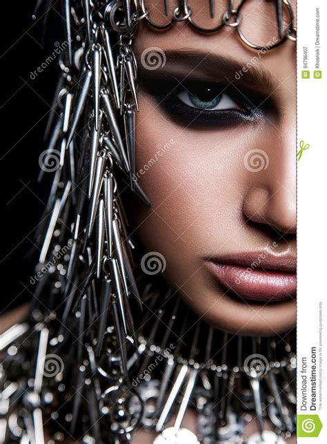 High Fashion Beauty Model With Metallic Headwear And Dark Makeup And
