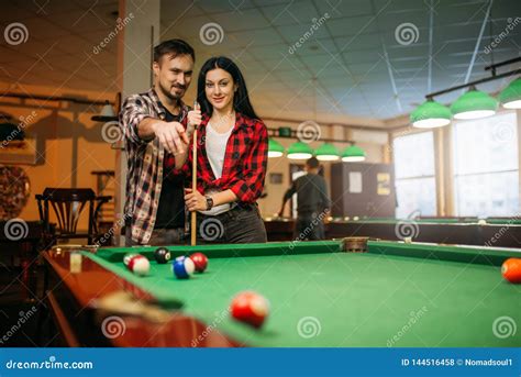 Female Billiard Player With Cue Poses At The Table Royalty Free Stock Image Cartoondealer Com