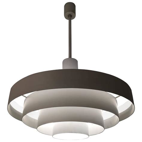 Placing it in your home will instantly enhance the ambiance of your home. Vintage White Metal Rings Pendant Lamp For Sale at 1stdibs