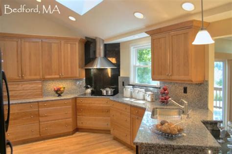 I am building a house and trying to plan the kitchen. Transitional Kitchen- Black Granite backsplash behind ...
