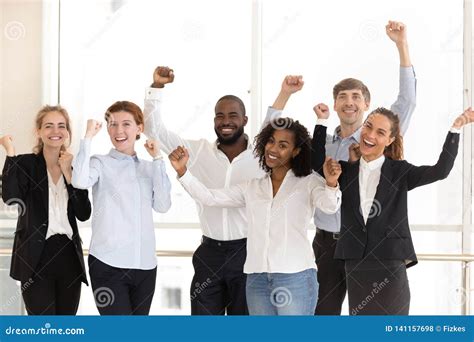 Happy Diverse Employees Celebrating Victory And Success At Work Stock