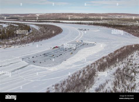 Aerial View Of People At Winter Ice Fishing Derby On The Mackenzie