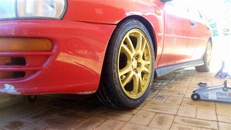 test fitted the gd sti wheels wrapped in 225 45 re003 s just need an alignment and i can get