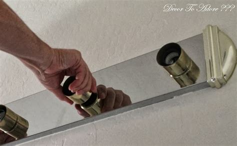 What should be a quick switchover soon turns into a nightmare when you realize that the fixture can't be unscrewed. How To Remove Ugly Bathroom Lighting - Decor to Adore