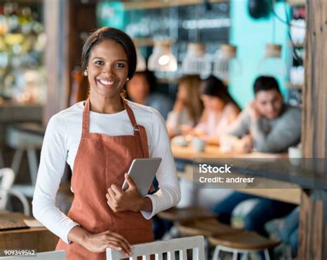 Happy Waitress Working At A Restaurant Stock Photo Download Image Now