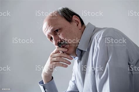 Head Portrait Of Senior Mature Old Man On His 60s Looking Sad And Worried Suffering Pain And