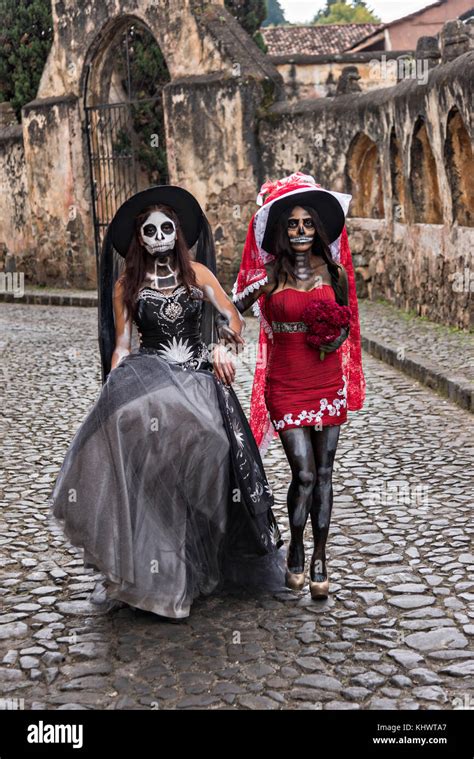 Young Mexican Women Dressed In La Calavera Catrina Costumes At The