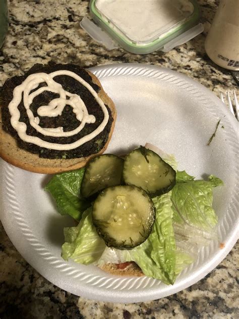 Portobello Mushroom Burger With Alkaline Pickles Ketchup And Mayo With Brazil Nut Cheese On An