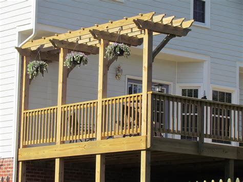 Having a vase open space can lacks a nice cosy feeling, making the space less enjoyable. Deck with Pergola - Midlothian | RVA Remodeling LLC