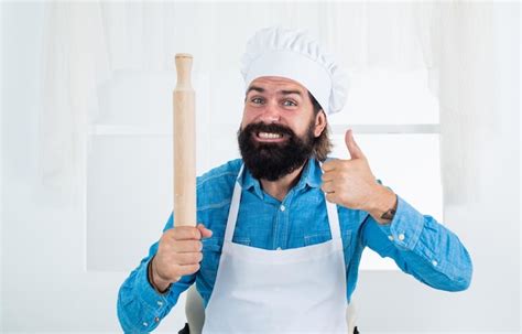 Premium Photo Happy Baking Concept Of Housekeeping Mature Bearded Man Wear Chef Hat Holding