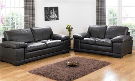 Two of the four chairs are a rich, dark leather, while the other two are a brown velour. Decorating a Room with Black Leather Sofa - Homedecorite