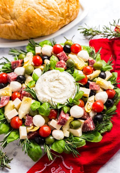A beautiful and festive appetizer to please a crowd. Antipasto Salad Christmas Wreath - an easy and festive holiday appetizer