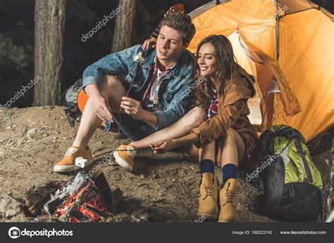 Couple Roasting Marshmallow — Stock Photo © Arturverkhovetskiy 168223742