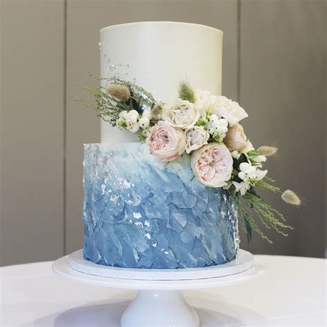 Two Tier Powered Blue And White Wedding Cake With Fresh Flowers And