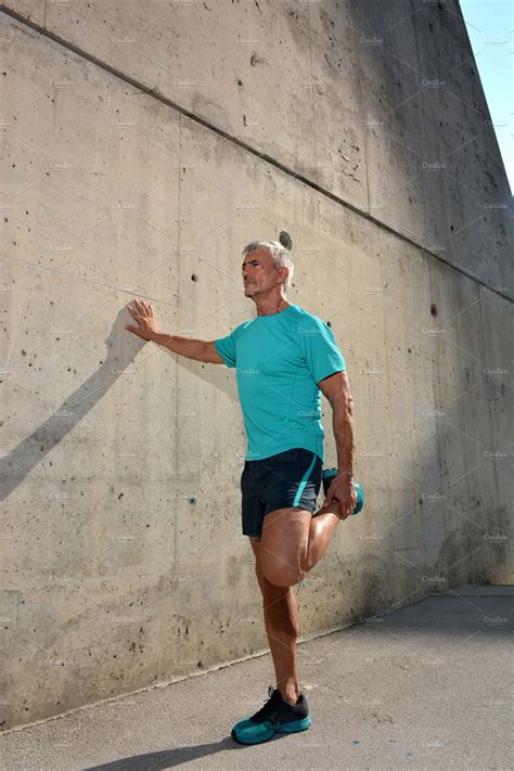 Older Man Practicing Stretching High Quality Sports Stock Photos