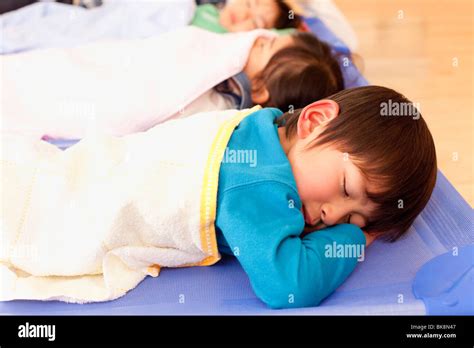 Children Sleeping At Day Care Center Stock Photo Alamy