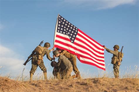 Soldiers Raising The Us Flag Stock Photo Download Image Now Istock