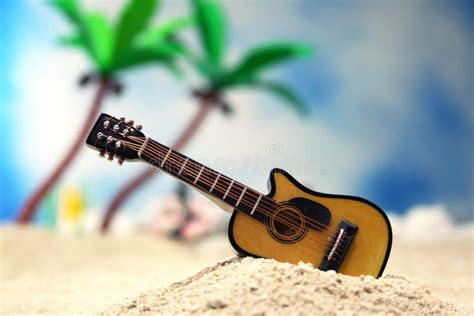 Guitar On Tropical Beach With Vintage Hot Rod In Background Stock Image