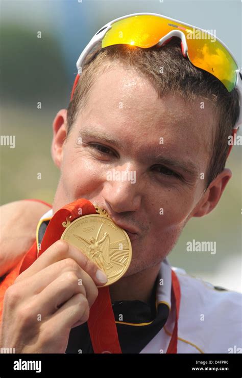 Jan Frodeno From Germany Celebrates Winning The Gold Medal In The Mens