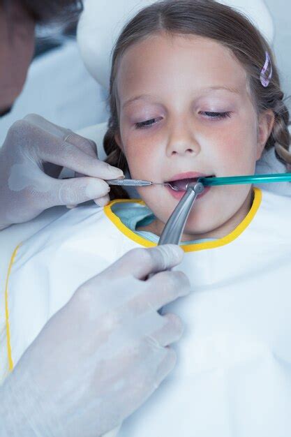 Premium Photo Close Up Of Girl Having Her Teeth Examined